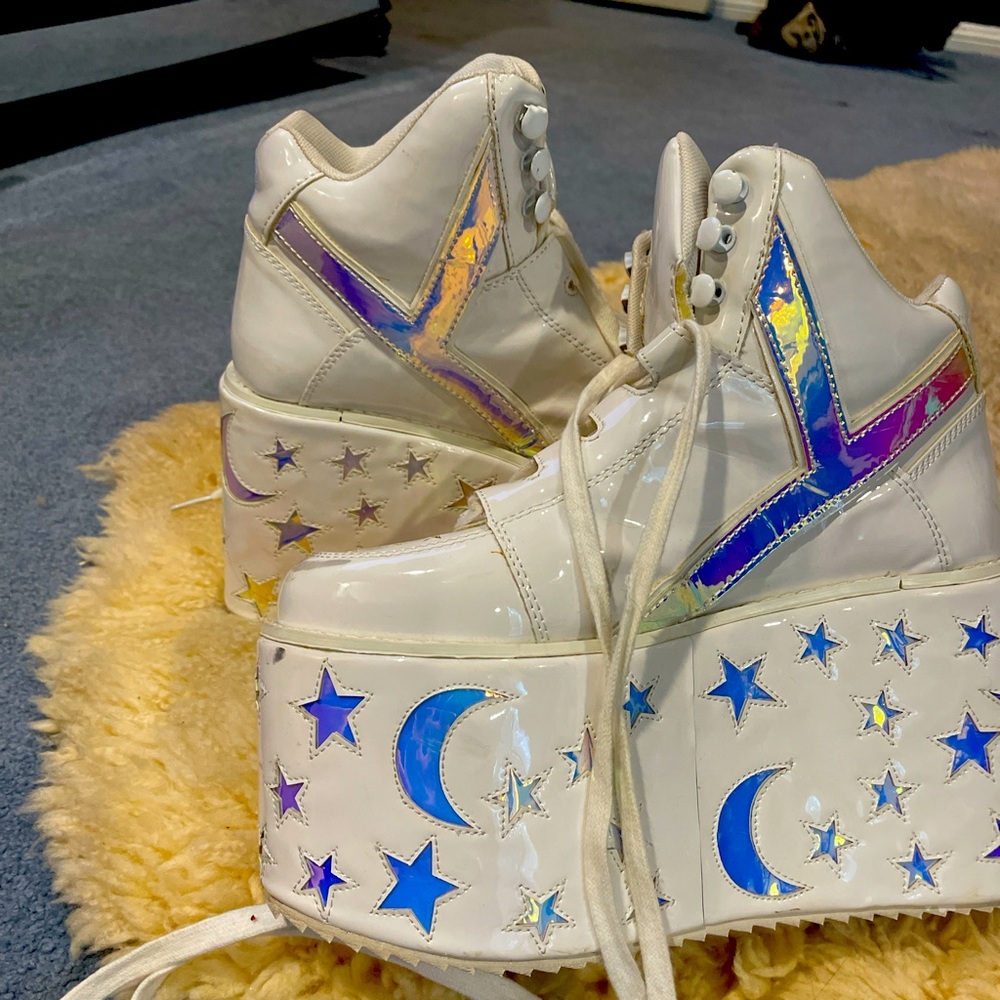 White and silver holographic YRU platform boots with star and moon design